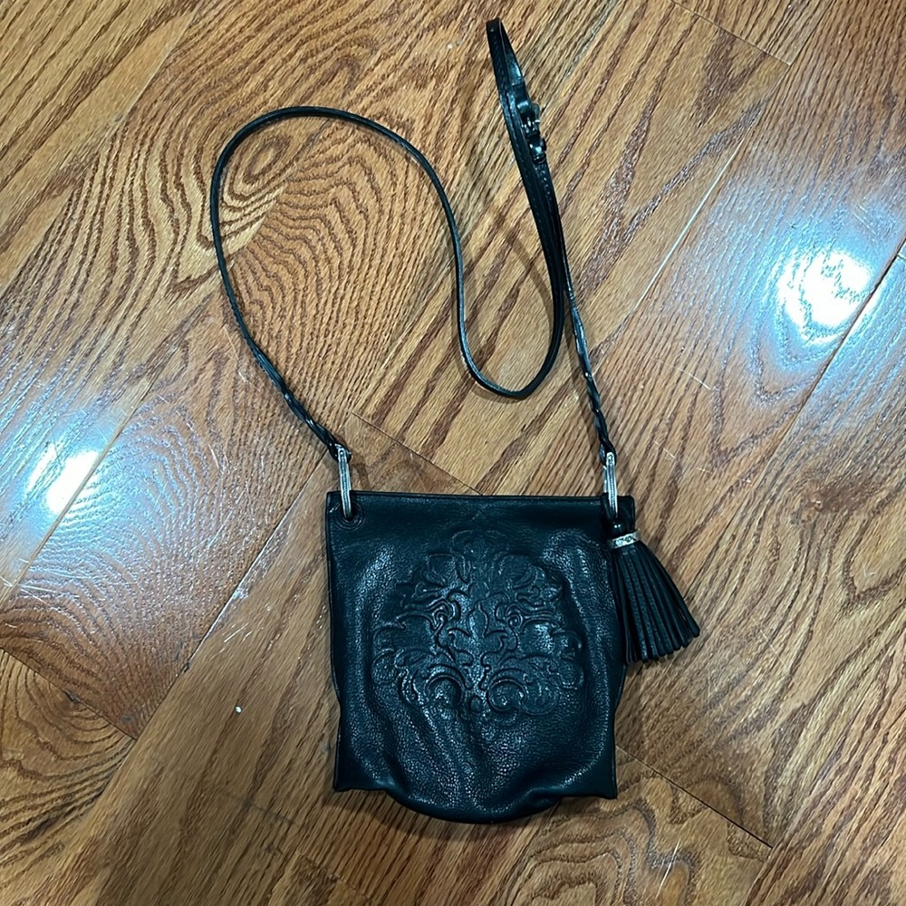 Brighton Black Leather Crossbody with Embossed Medallion and Tassel